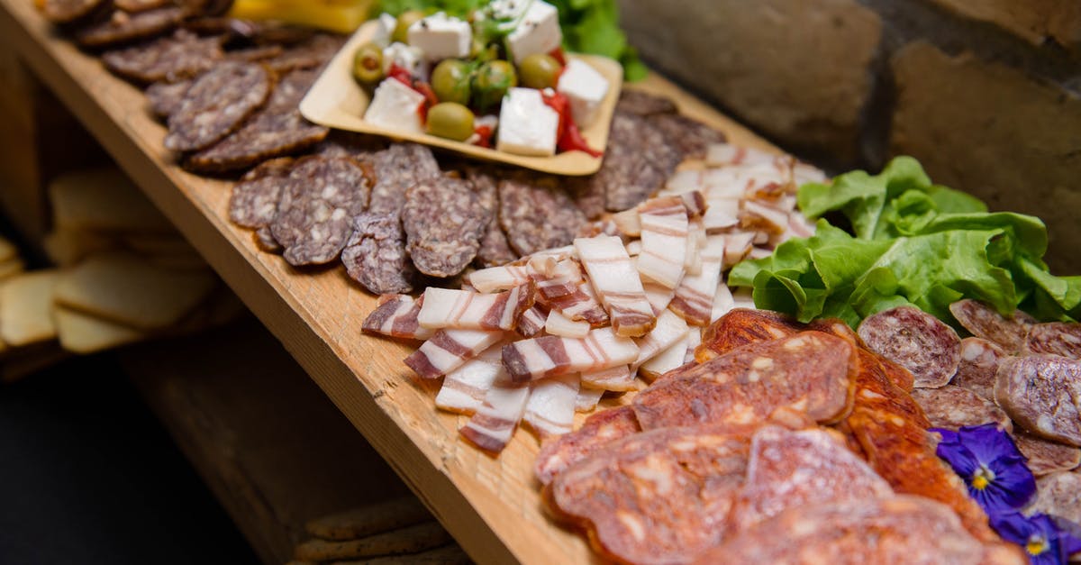 How to keep flies away from curing meat - High angle appetizing sliced cured pork fat and smoked sausages served on sideboard with cheese and olives during buffet catering How to keep flies away from curing meat - High angle appetizing sliced cured pork fat and smoked sausages served on sideboard with cheese and olives during buffet catering