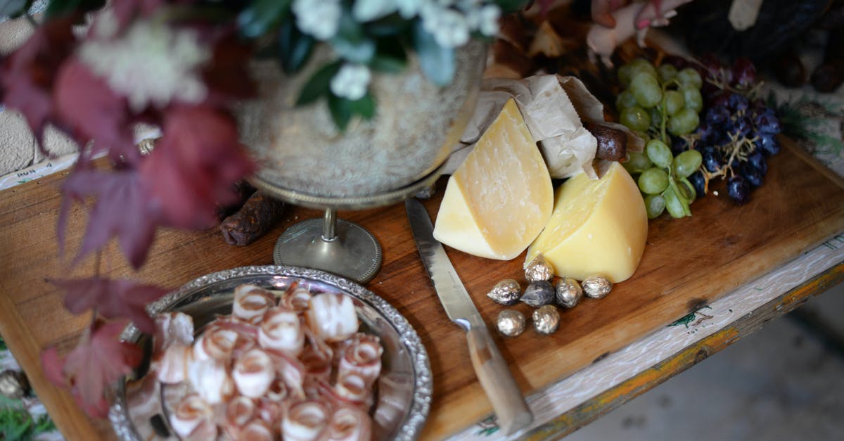 How to keep flies away from curing meat - From above of served wooden board with bacon plate cheese and grapes near knife and bunch of flowers How to keep flies away from curing meat - From above of served wooden board with bacon plate cheese and grapes near knife and bunch of flowers