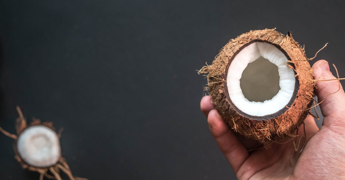 How to keep opened coconut safely? - Person Holding Opened Coconut How to keep opened coconut safely? - Person Holding Opened Coconut