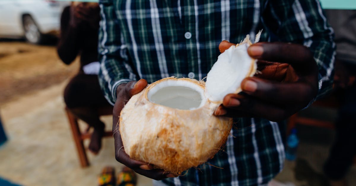How to keep opened coconut safely? - Person Holding Open Coconut Fruit How to keep opened coconut safely? - Person Holding Open Coconut Fruit