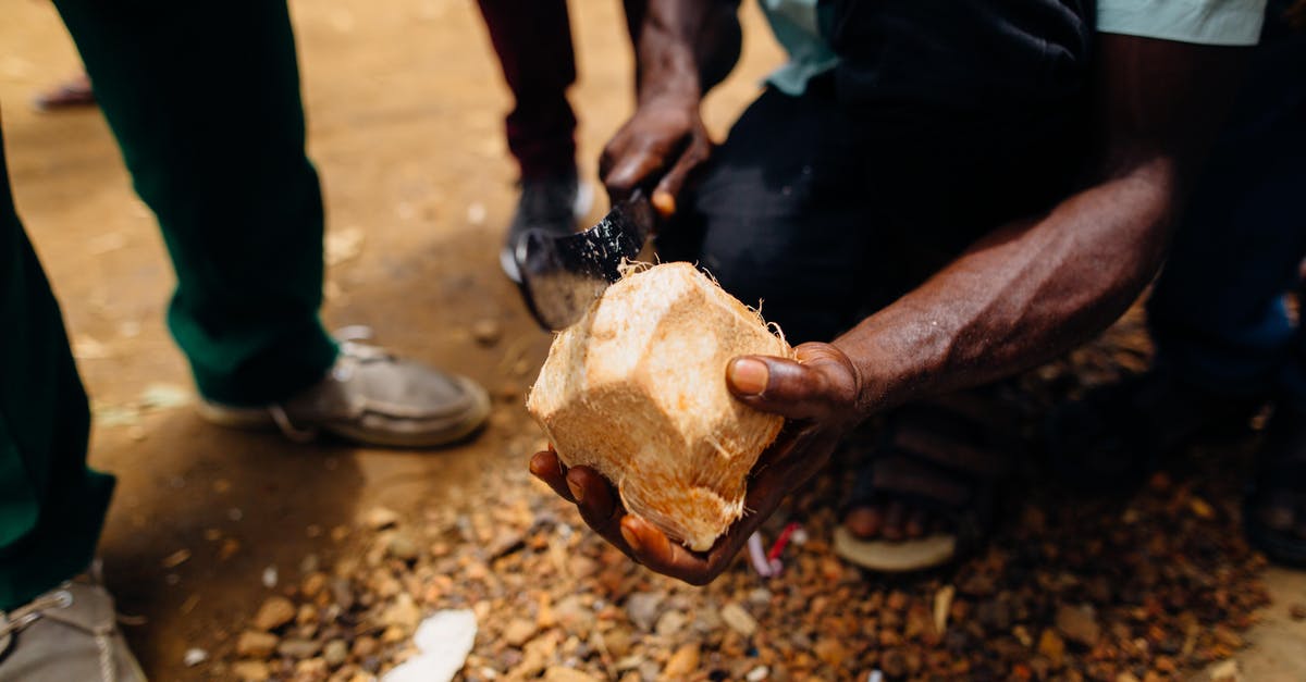 How to keep opened coconut safely? - Person Slicing Coconut Fruit How to keep opened coconut safely? - Person Slicing Coconut Fruit