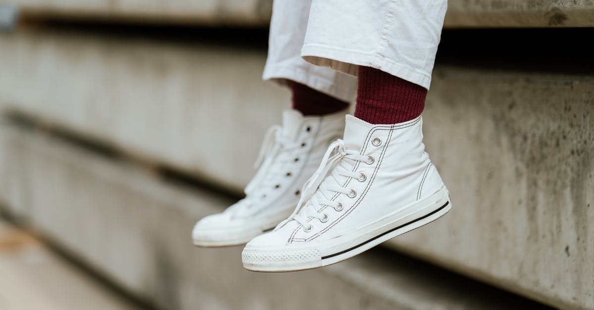 How to know if Dover Sole is fresh? - Crop unrecognizable person in stylish sneakers sitting on concrete beam How to know if Dover Sole is fresh? - Crop unrecognizable person in stylish sneakers sitting on concrete beam