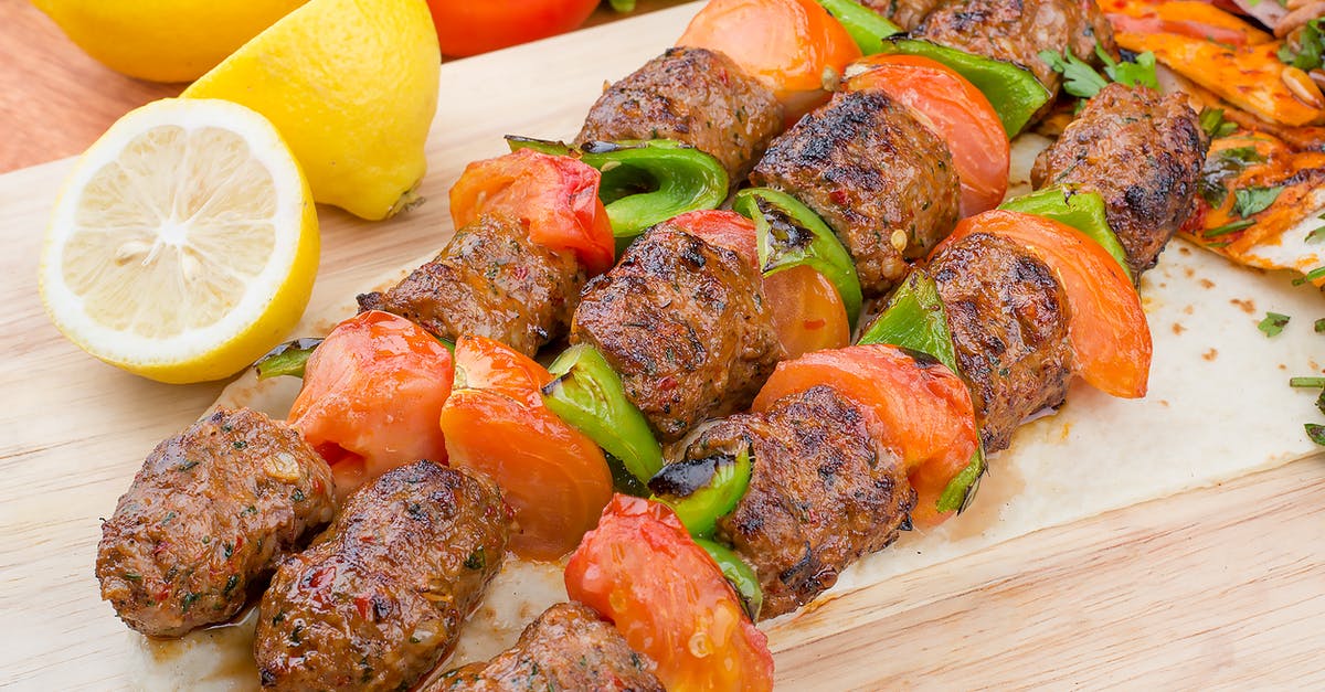 How to make a Lamb Seekh Kebab more juicy and soft? - Grilled Meat With Sliced Lemon and Green Vegetable on Brown Wooden Chopping Board How to make a Lamb Seekh Kebab more juicy and soft? - Grilled Meat With Sliced Lemon and Green Vegetable on Brown Wooden Chopping Board