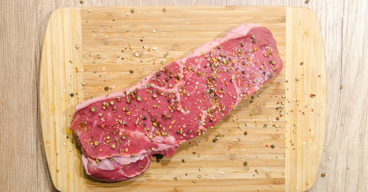 How to make a pepper crusted steak - Flat Lay Photography of Slice of Meat on Top of Chopping Board Sprinkled With Ground Peppercorns How to make a pepper crusted steak - Flat Lay Photography of Slice of Meat on Top of Chopping Board Sprinkled With Ground Peppercorns