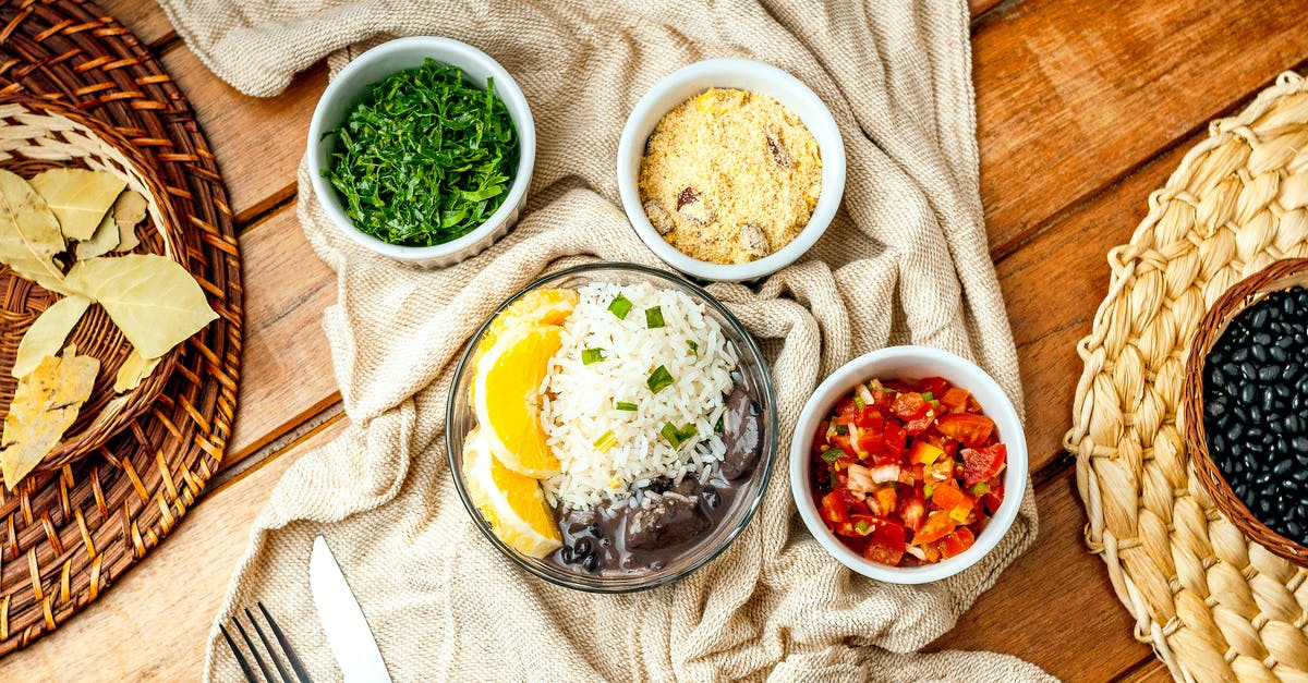 How to make Black Glutinous Rice sticky? - Delectable rice with bean stew served with tomatoes and parsley How to make Black Glutinous Rice sticky? - Delectable rice with bean stew served with tomatoes and parsley