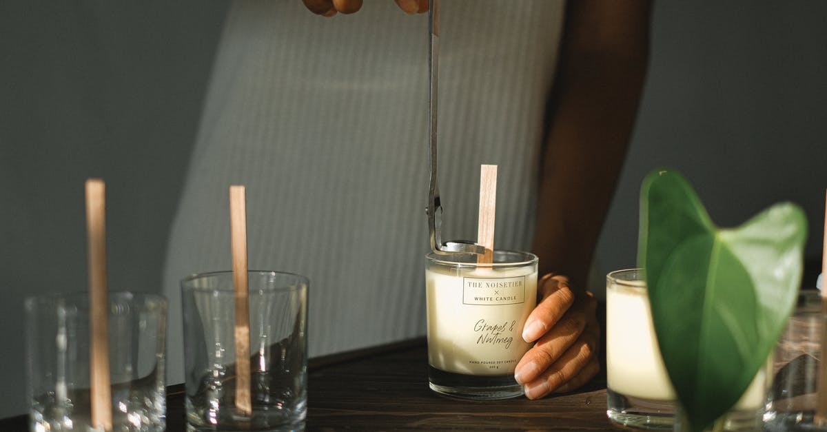 How to make Black Glutinous Rice sticky? - Crop black woman with trimmer preparing candles with wicks How to make Black Glutinous Rice sticky? - Crop black woman with trimmer preparing candles with wicks