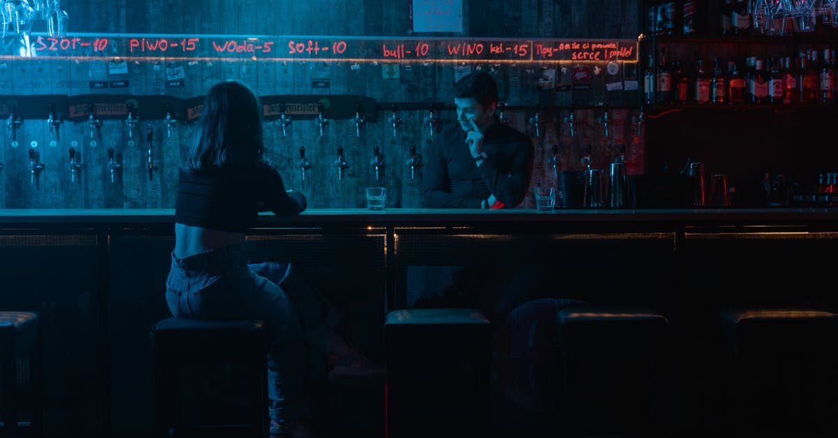How to make club soda - Man and Woman Sitting on Chair in Front of Table How to make club soda - Man and Woman Sitting on Chair in Front of Table
