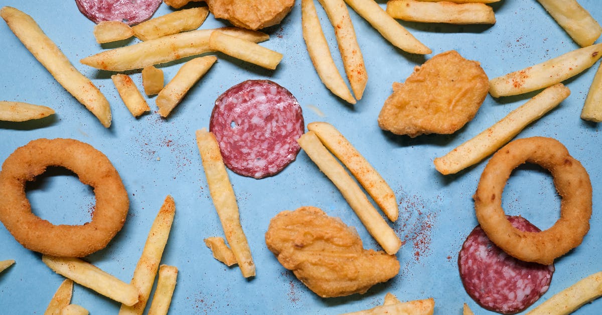 How to make crispy French fries? - Salami with onion rings and nuggets near french fries How to make crispy French fries? - Salami with onion rings and nuggets near french fries
