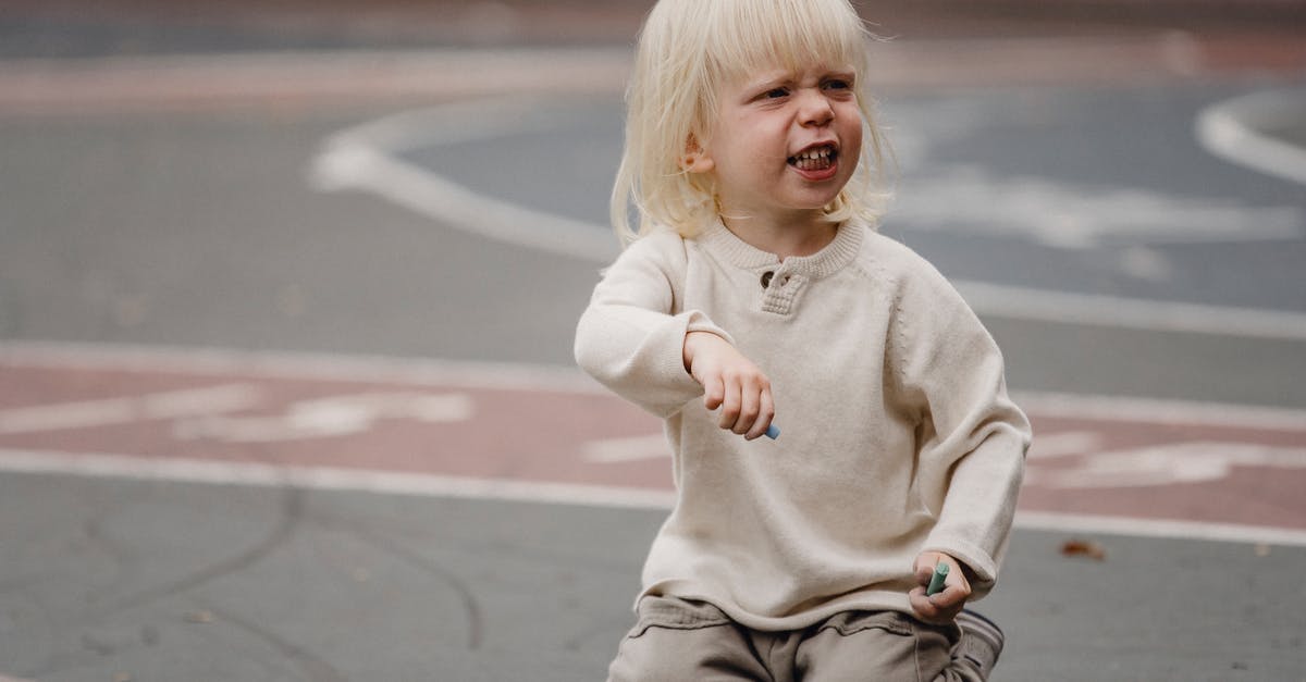 How to make ground almonds creamy? - Full length dissatisfied little girl with chalks in casual wear sitting on asphalt ground and looking away How to make ground almonds creamy? - Full length dissatisfied little girl with chalks in casual wear sitting on asphalt ground and looking away