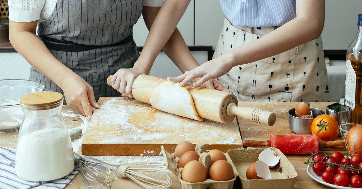 How to Make Home-made Flour Tortilla Bowls for Salads? - Crop women rolling dough on board