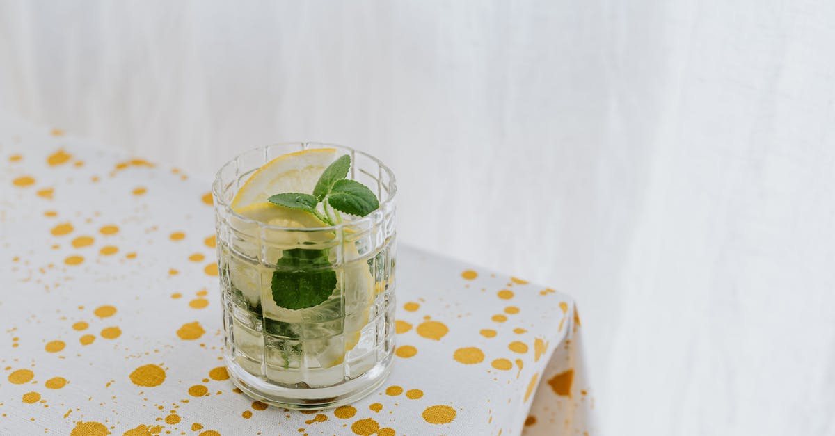 How to make mint syrup with minimum water? - Glass of fresh cocktail on table How to make mint syrup with minimum water? - Glass of fresh cocktail on table