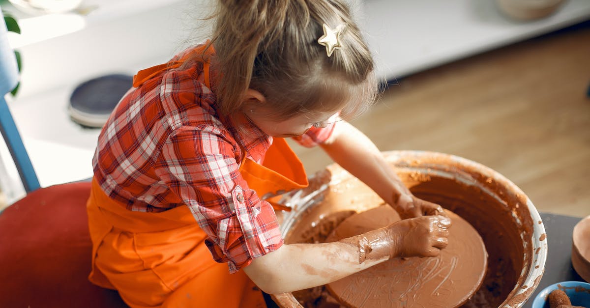 How to make potato wheel not stick to mold - From above anonymous little girl in red check shirt and apron working with clay on pottery wheel while spending time in workshop How to make potato wheel not stick to mold - From above anonymous little girl in red check shirt and apron working with clay on pottery wheel while spending time in workshop