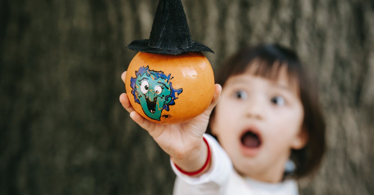 How to make Pumpkin Fries - Little girl with opened mouth in white outfit demonstrating pumpkin decorated and painted for Halloween How to make Pumpkin Fries - Little girl with opened mouth in white outfit demonstrating pumpkin decorated and painted for Halloween