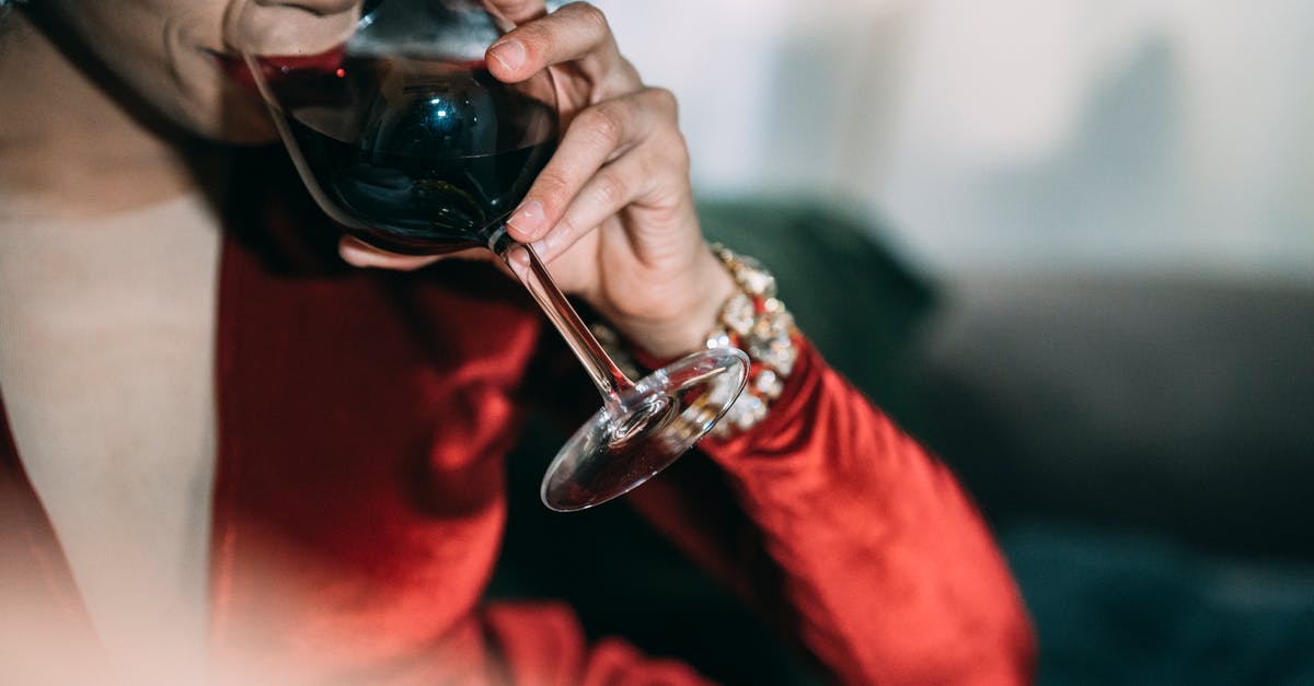 How to make red wine sauce? - Crop unrecognizable female in bright red dress with jewelry drinking red wine on blurred background How to make red wine sauce? - Crop unrecognizable female in bright red dress with jewelry drinking red wine on blurred background