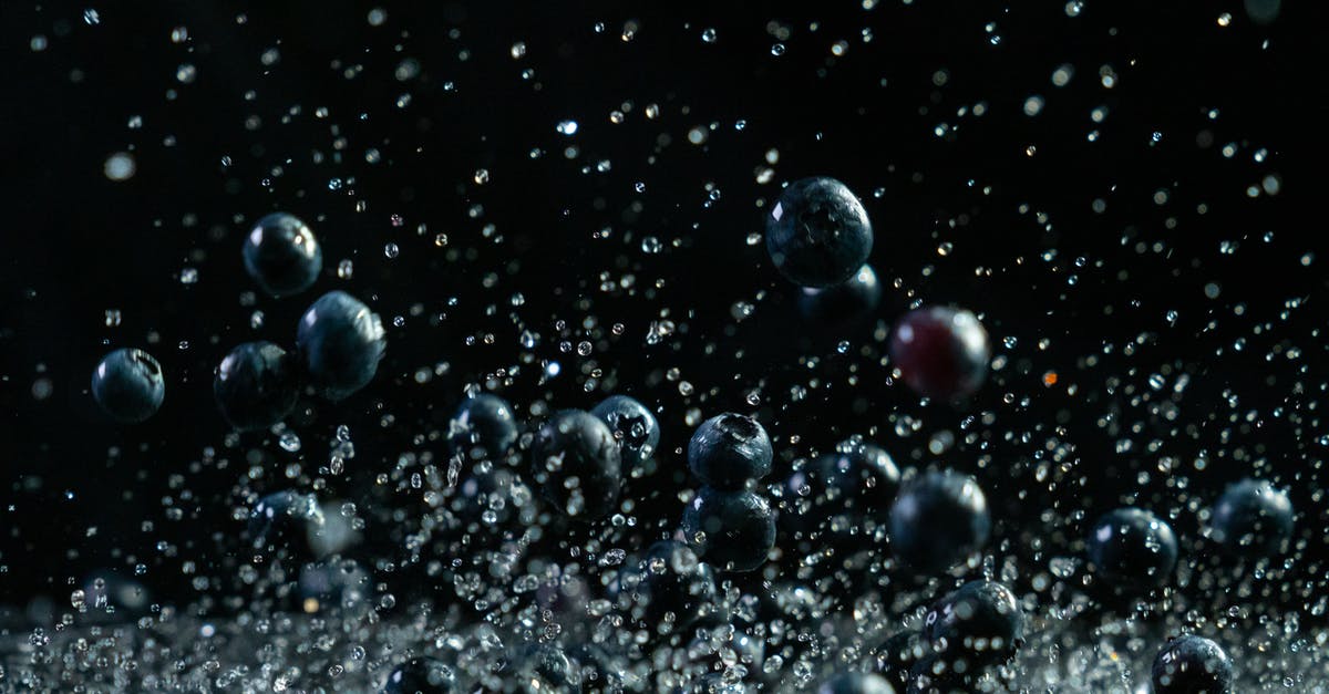 How to make round popcorn? - Close-Up Photo of Blueberries in Black Background How to make round popcorn? - Close-Up Photo of Blueberries in Black Background