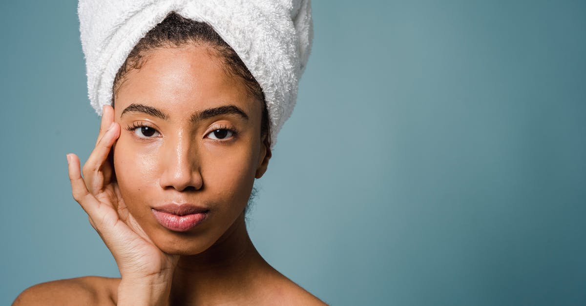 How to Make the perfect French Custard? - Tranquil young black female with pure skin and white towel on head touching face and looking at camera after spa procedures against blue background How to Make the perfect French Custard? - Tranquil young black female with pure skin and white towel on head touching face and looking at camera after spa procedures against blue background