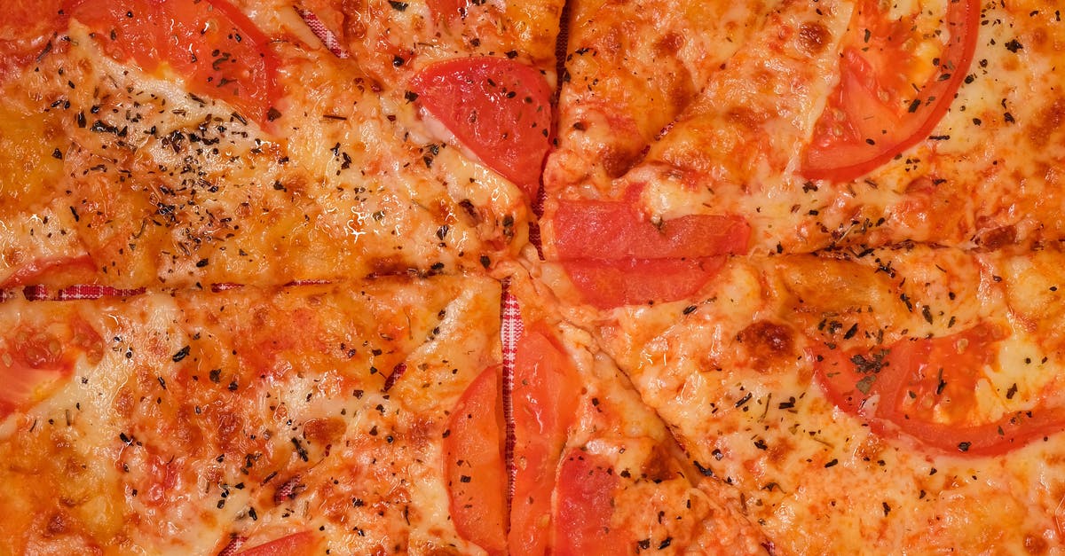 How to make (vegan) cheese saltier? - Pizza with tomatoes and cheese on table