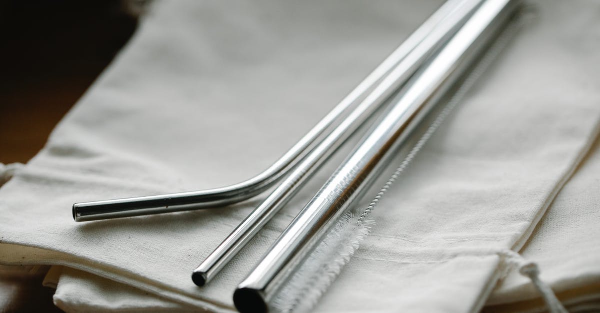 How to mask/reduce stevia's metallic after taste? - Collection of stainless steel straight and bent straws placed on reusable bags on table How to mask/reduce stevia's metallic after taste? - Collection of stainless steel straight and bent straws placed on reusable bags on table
