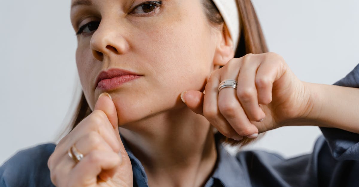 How to massage an octopus? - Woman in Blue Collared Shirt Wearing Silver Ring