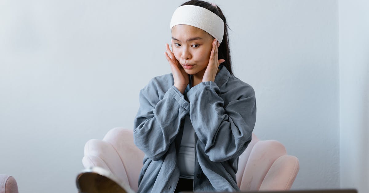 How to massage an octopus? - Woman in Gray Hoodie Sitting on Chair