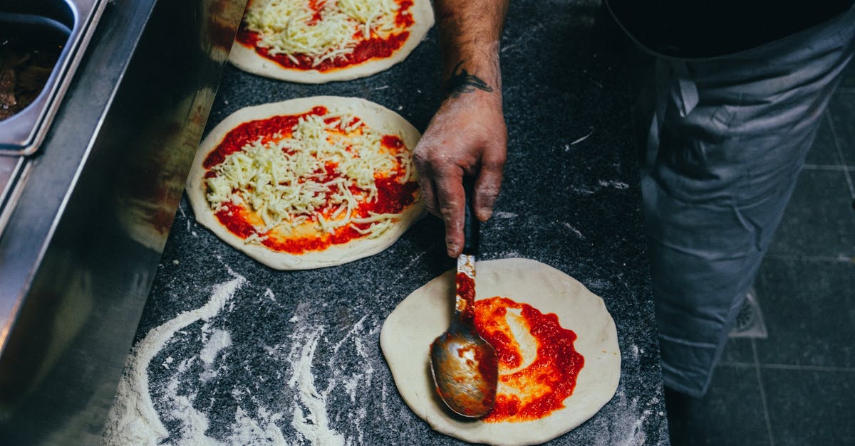 How to measure tomatoes for making sauce? - Person Spreading Tomato Sauce onto Pizza Dough How to measure tomatoes for making sauce? - Person Spreading Tomato Sauce onto Pizza Dough