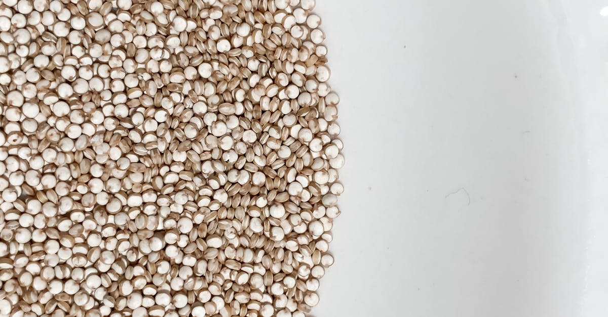 How to minimize the impact of unpopped kernels and kernel shards in popcorn? - Heap of small brown cereal grains How to minimize the impact of unpopped kernels and kernel shards in popcorn? - Heap of small brown cereal grains