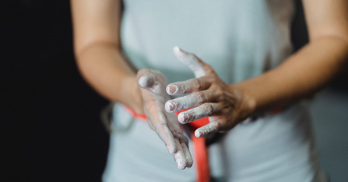 How to move powders to avoid spillage? - Sportswoman with talc on hands How to move powders to avoid spillage? - Sportswoman with talc on hands