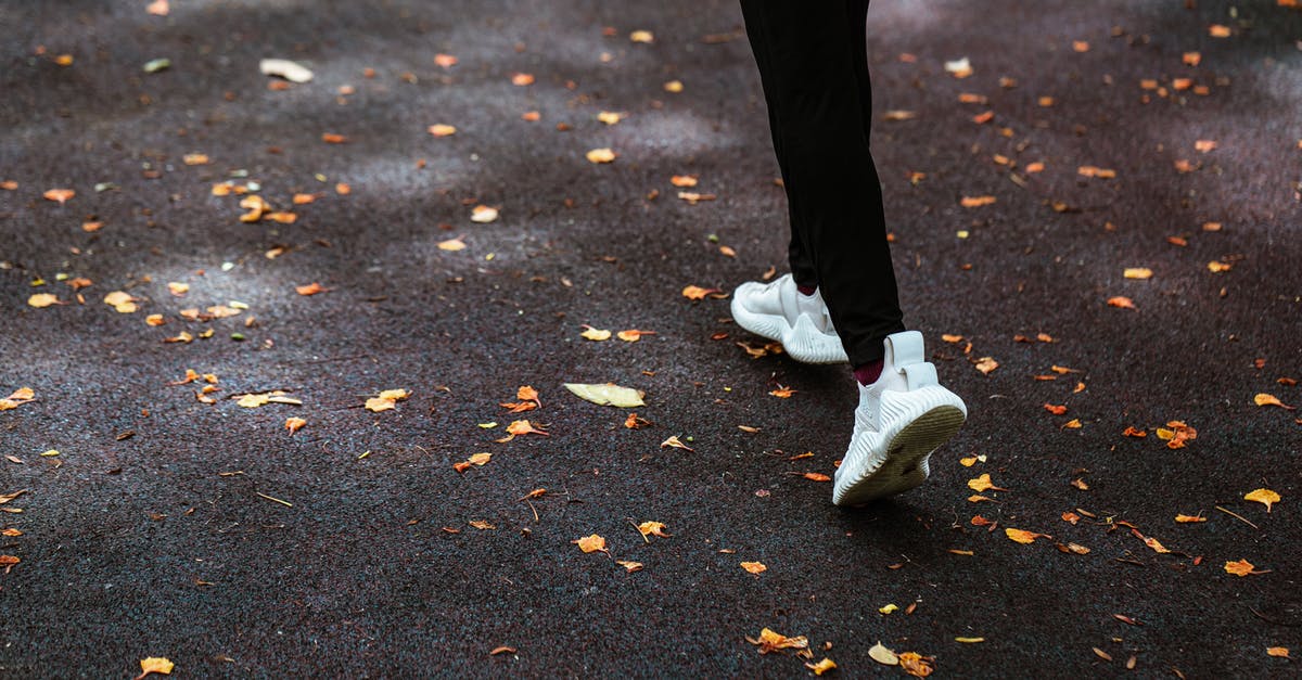 How to move powders to avoid spillage? - Faceless person running on dark pavement How to move powders to avoid spillage? - Faceless person running on dark pavement