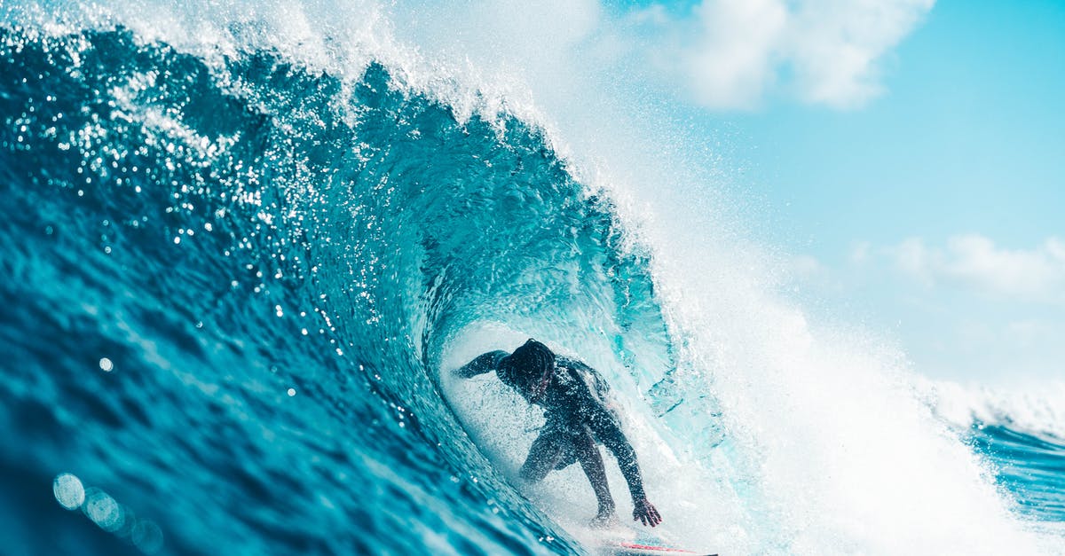 How to move powders to avoid spillage? - Unrecognizable energetic surfer riding azure sea wave How to move powders to avoid spillage? - Unrecognizable energetic surfer riding azure sea wave