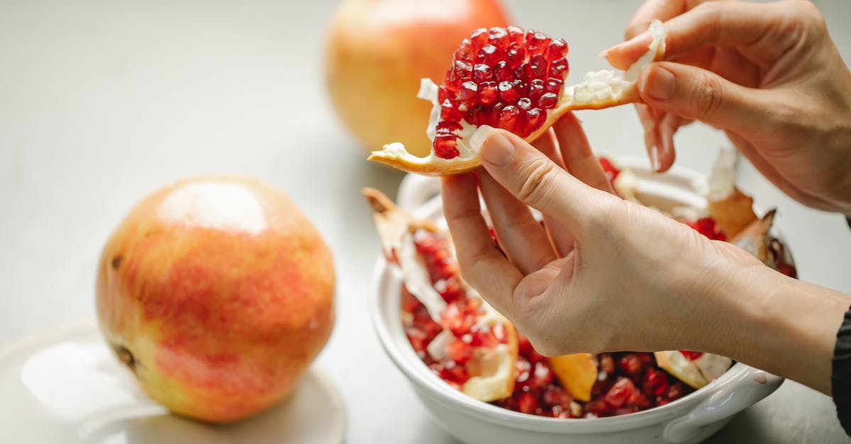how to peel a pomegranate efficiently? - High angle side view of crop anonymous female preparing vitamin seeds of pomegranate for healthy lunch how to peel a pomegranate efficiently? - High angle side view of crop anonymous female preparing vitamin seeds of pomegranate for healthy lunch