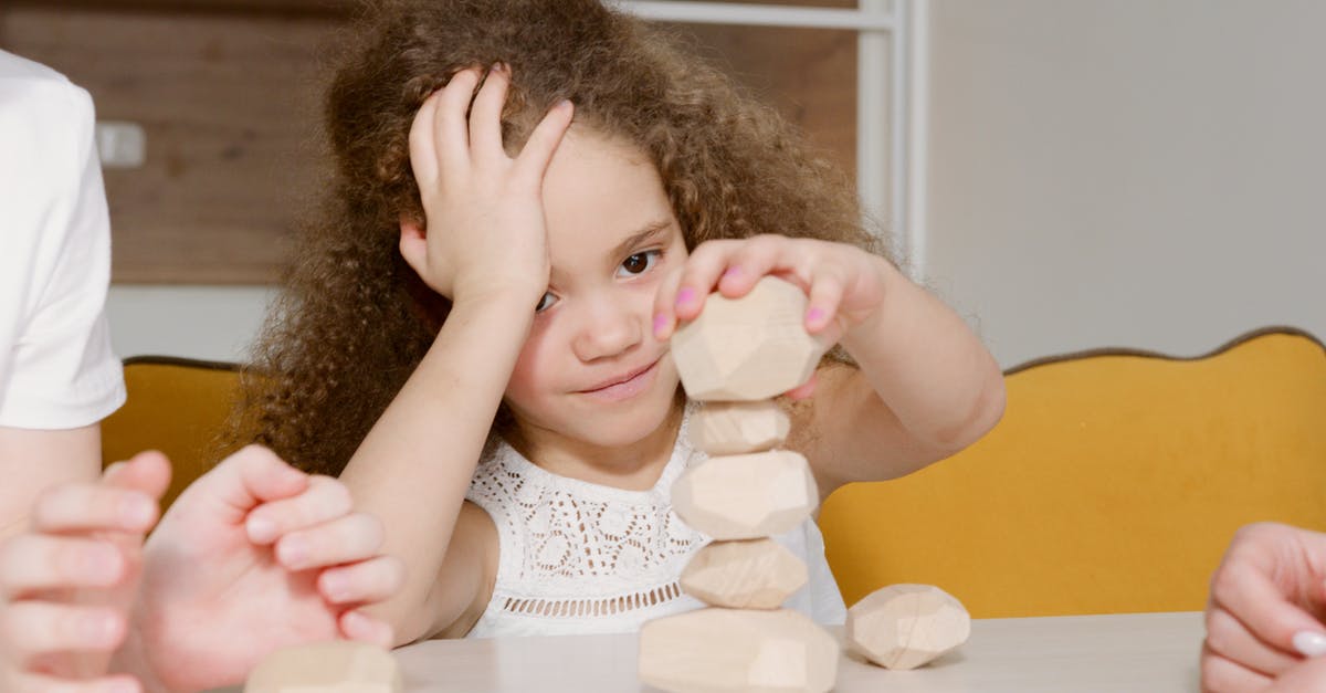 How to Peel Potatoes - A Girl Stacking Pieces of Peeled Potatoes