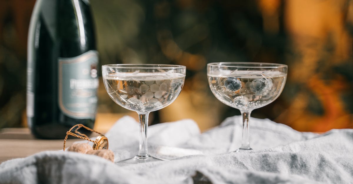 How to pop a tiny champagne cork? - Clear Wine Glass on White Textile How to pop a tiny champagne cork? - Clear Wine Glass on White Textile