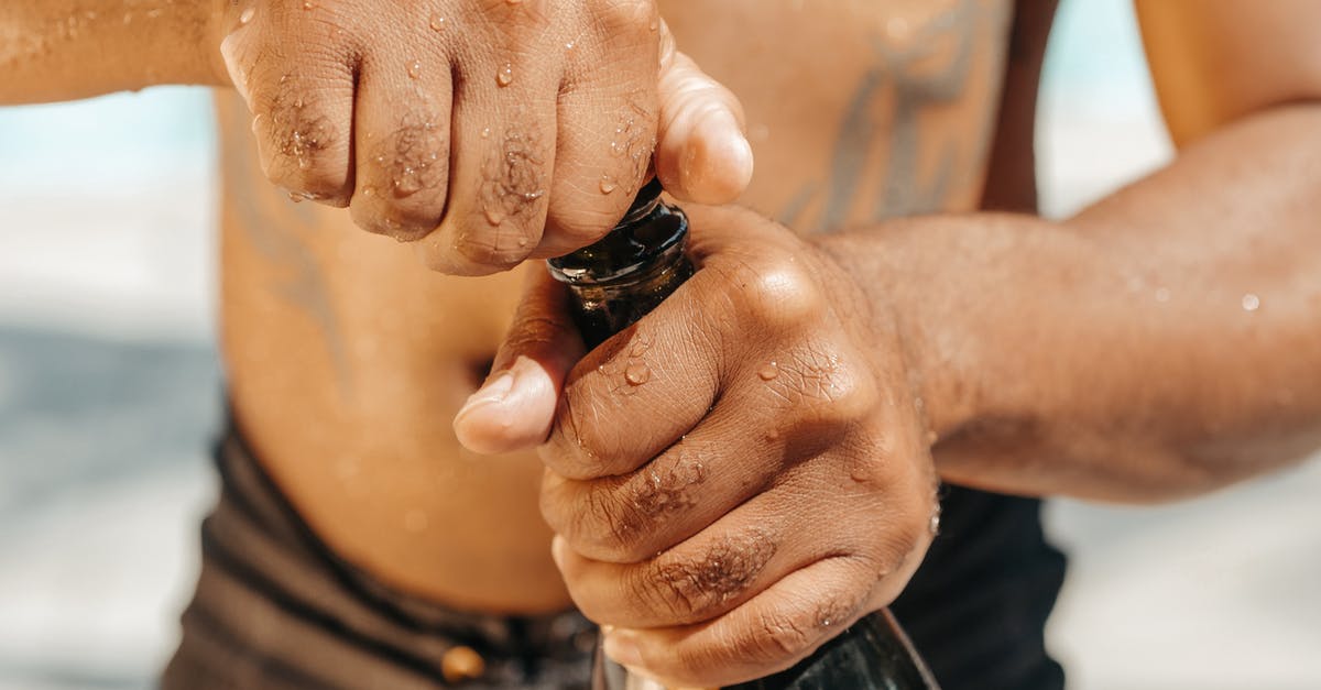 How to pop a tiny champagne cork? - Close-Up Photo of Person Opening a Champagne Bottle How to pop a tiny champagne cork? - Close-Up Photo of Person Opening a Champagne Bottle