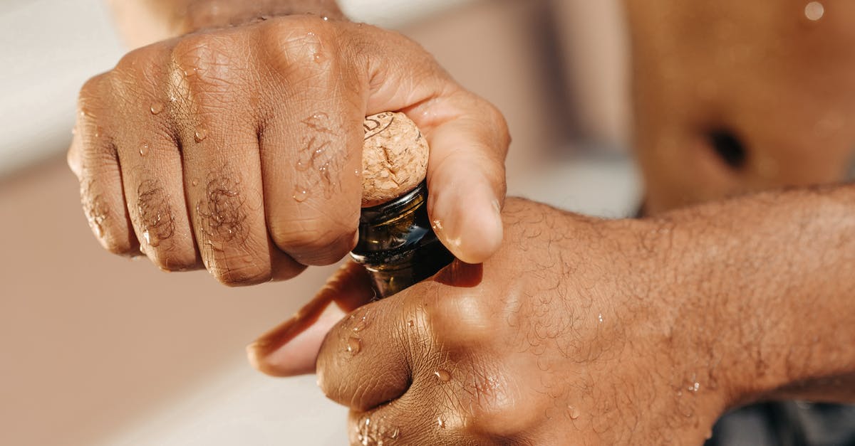 How to pop a tiny champagne cork? - Close-Up Photo of Person Opening a Champagne Bottle How to pop a tiny champagne cork? - Close-Up Photo of Person Opening a Champagne Bottle