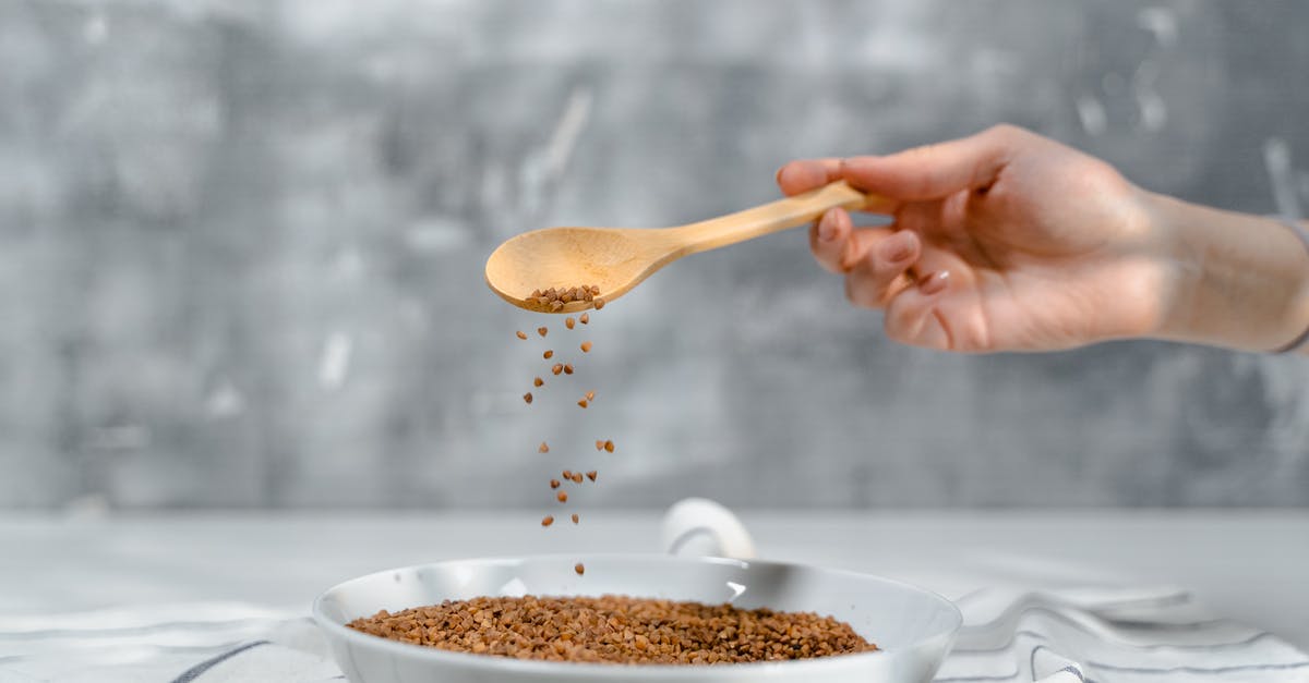 How to predict and adjust the spice level of dal? - Person Holding Brown Wooden Spoon With White Powder How to predict and adjust the spice level of dal? - Person Holding Brown Wooden Spoon With White Powder
