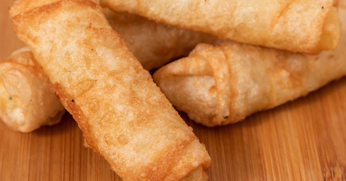 How to prepare an easy and fast snack rich in protein? [closed] - Closeup of fried spring rolls on board