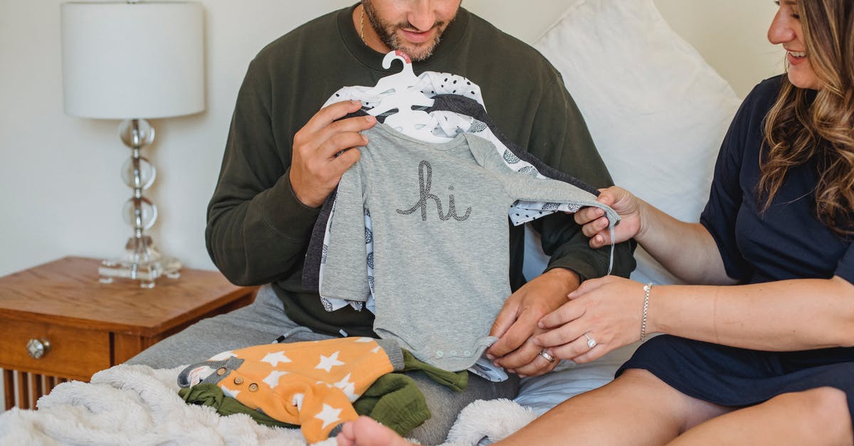 How to prepare baby lima beans for this paella recipe? - Crop pregnant woman with husband watching baby wear on bed How to prepare baby lima beans for this paella recipe? - Crop pregnant woman with husband watching baby wear on bed