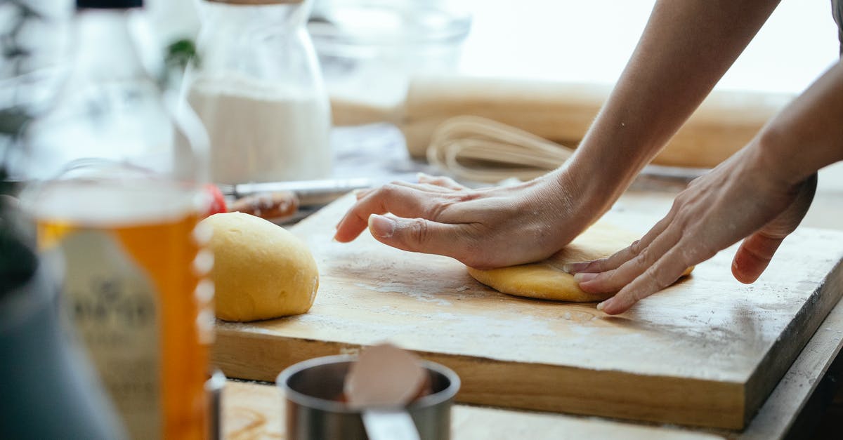 How to prepare pie dough in bulk at home? - Female hands kneading fresh dough on wooden chopping board with flour in kitchen How to prepare pie dough in bulk at home? - Female hands kneading fresh dough on wooden chopping board with flour in kitchen