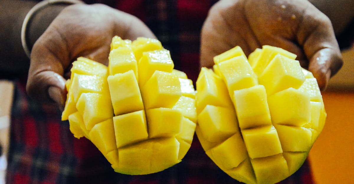 How to prepare summer squash without the peel becoming rubbery - Ethnic person showing bright cut mango How to prepare summer squash without the peel becoming rubbery - Ethnic person showing bright cut mango