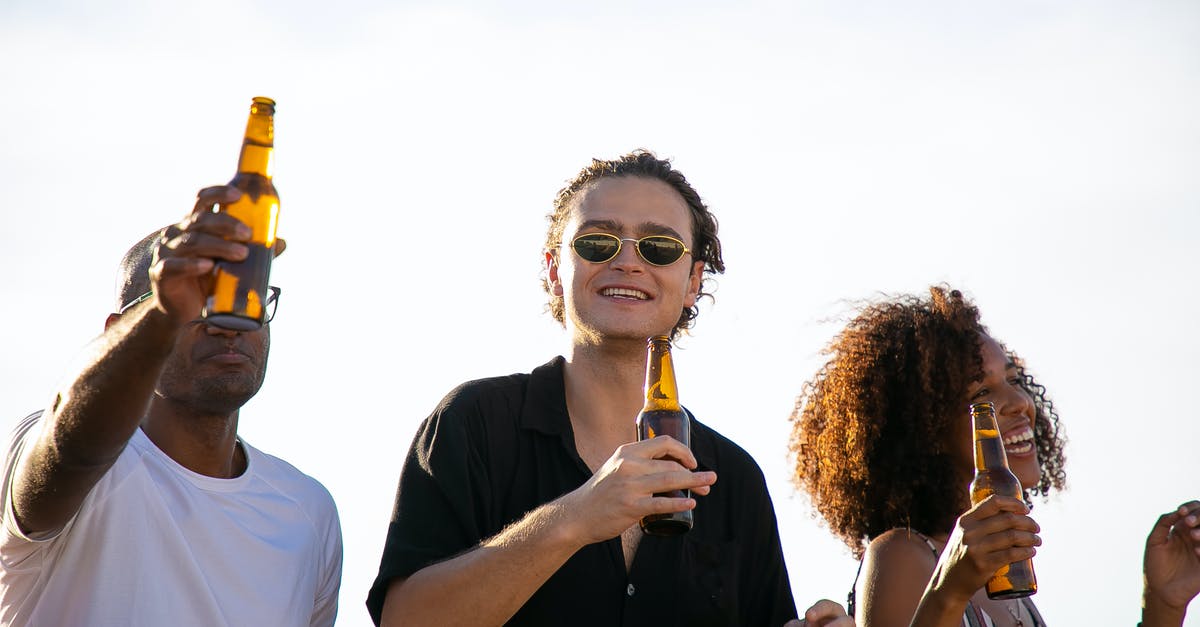 How to preserve this alcohol free herbal bitter? - Cheerful diverse friends drinking beer during celebration party