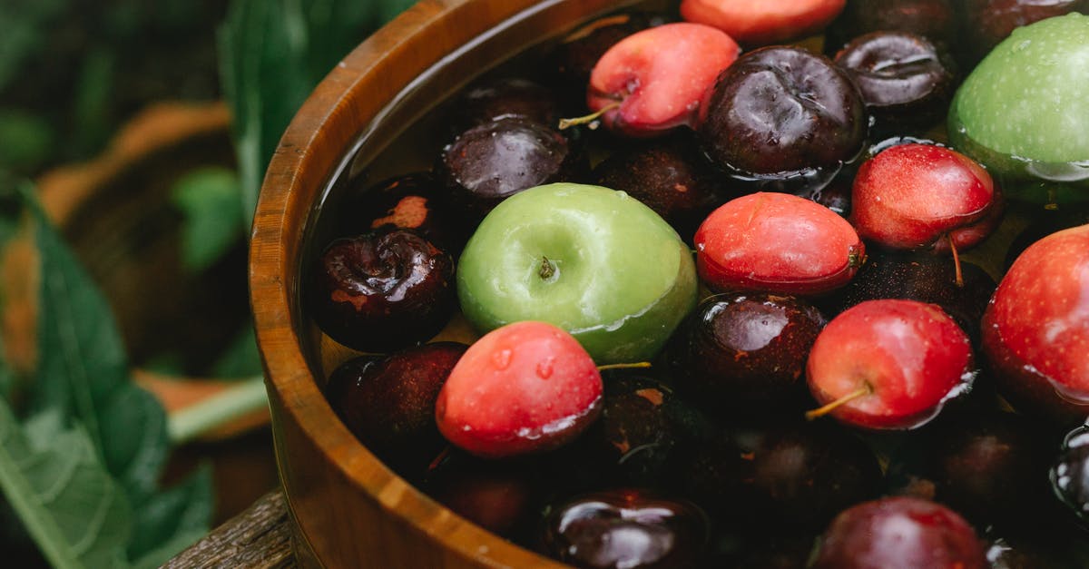 How to Prevent Apples from turning Brown - Closeup of ripe delicious tasty fruits in wooden bowl in forest in daylight How to Prevent Apples from turning Brown - Closeup of ripe delicious tasty fruits in wooden bowl in forest in daylight