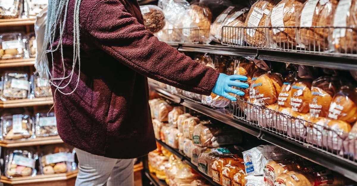 How to prevent bread sticking to cast iron pan? - Side view of crop anonymous female customer picking loaf of bread in supermarket during coronavirus epidemic How to prevent bread sticking to cast iron pan? - Side view of crop anonymous female customer picking loaf of bread in supermarket during coronavirus epidemic