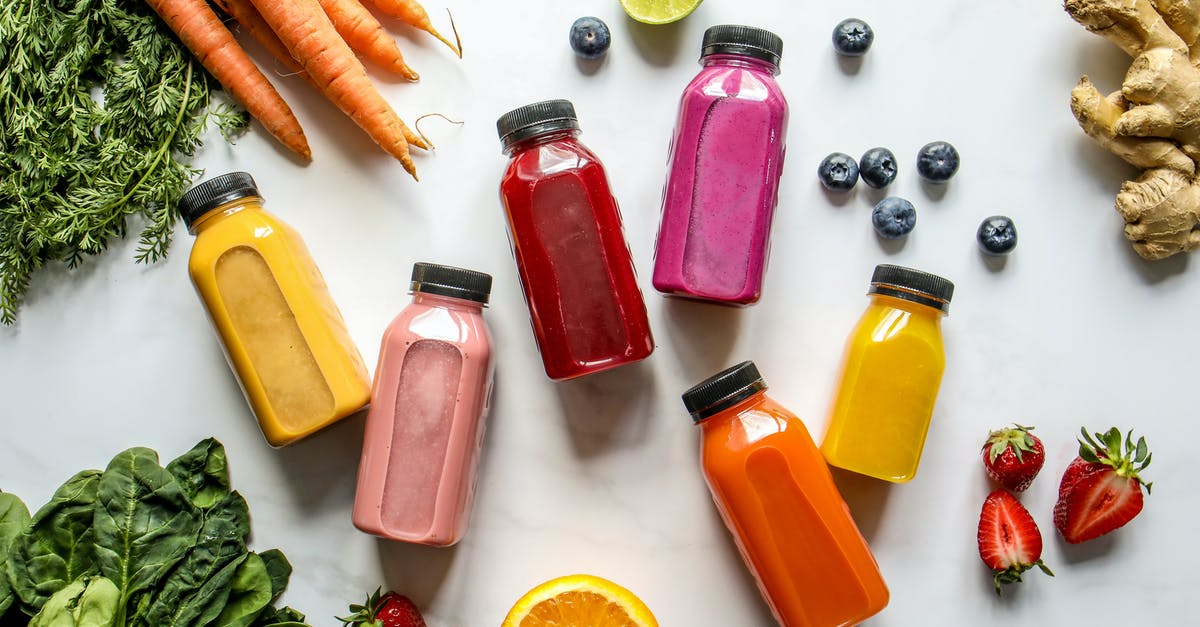 How to prevent carrot juice from turning brown? - Colorful Bottles with Smoothies Beside Carrots, Ginger, Leaves and Berries How to prevent carrot juice from turning brown? - Colorful Bottles with Smoothies Beside Carrots, Ginger, Leaves and Berries