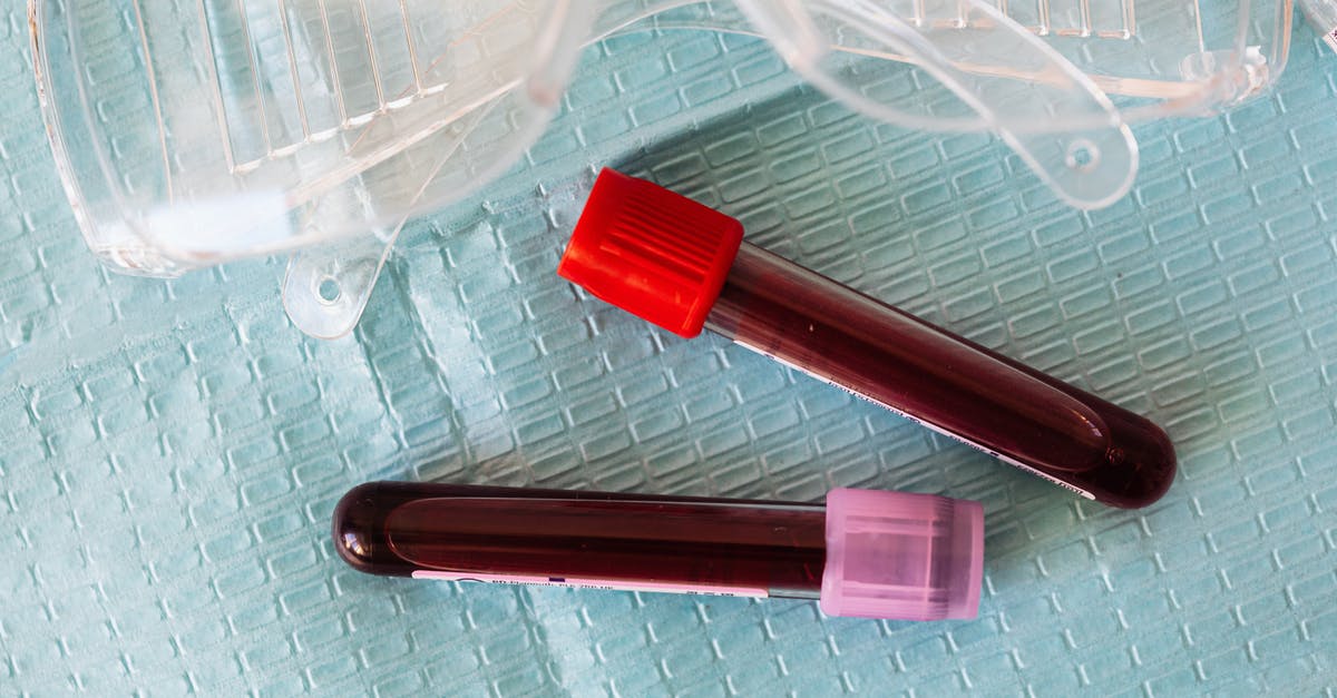How to prevent liquid-y marinara sauce - Top view closeup of protective plastic eyeglasses and full of blood vials placed on medical diaper How to prevent liquid-y marinara sauce - Top view closeup of protective plastic eyeglasses and full of blood vials placed on medical diaper
