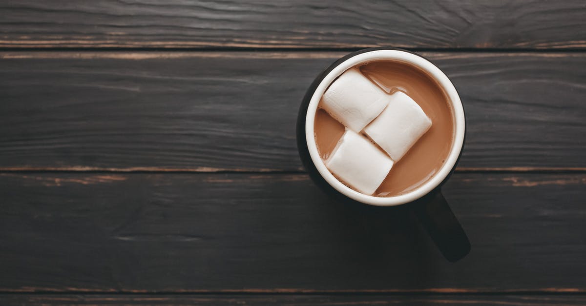 How to prevent my marshmallows from melting in my hot cocoa? - From above mug of delicious aromatic cocoa with marshmallows served on wooden table How to prevent my marshmallows from melting in my hot cocoa? - From above mug of delicious aromatic cocoa with marshmallows served on wooden table