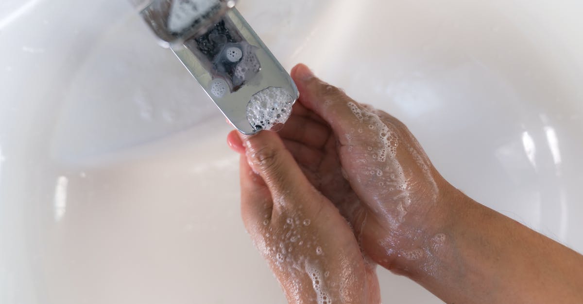 How to prevent pureed blueberries from gelling? - Crop person washing hands over white sink How to prevent pureed blueberries from gelling? - Crop person washing hands over white sink