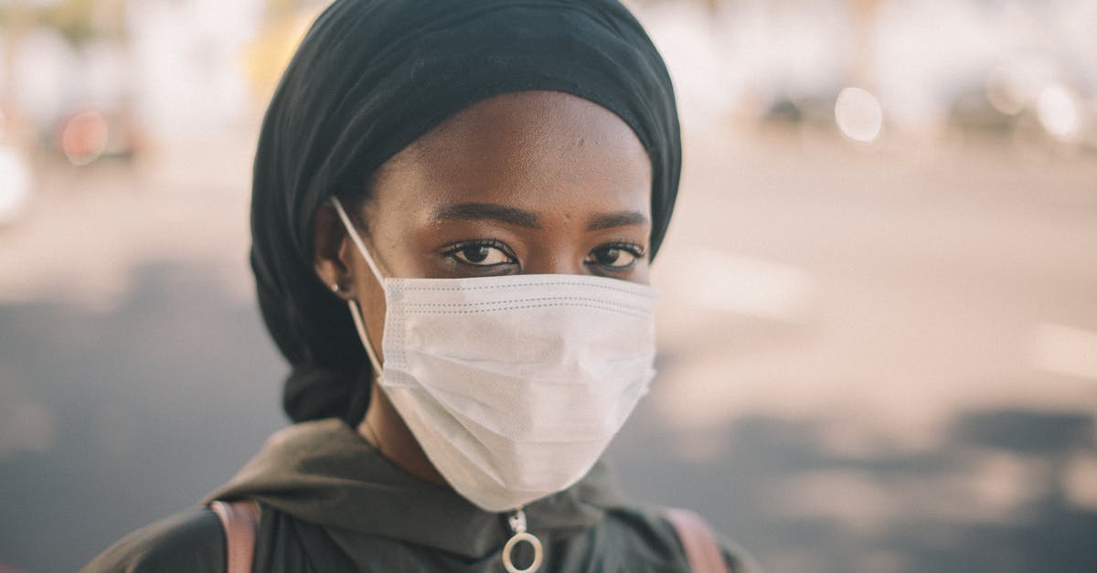 How to prevent "sweating" chocolate covered strawberries? - Unrecognizable young ethnic woman in jacket and headscarf and protective mask standing on city street How to prevent "sweating" chocolate covered strawberries? - Unrecognizable young ethnic woman in jacket and headscarf and protective mask standing on city street