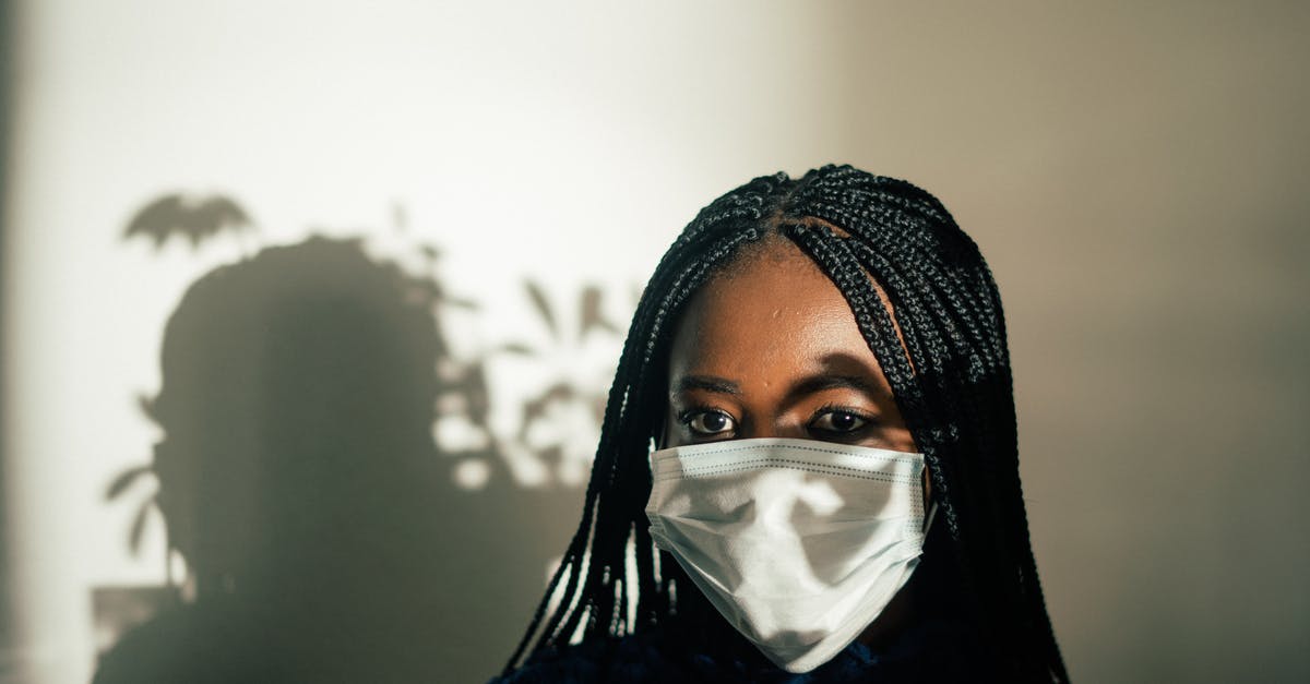 How to prevent "sweating" chocolate covered strawberries? - Unrecognizable African American female in medical mask against white wall with shadow of leaves plant on face How to prevent "sweating" chocolate covered strawberries? - Unrecognizable African American female in medical mask against white wall with shadow of leaves plant on face