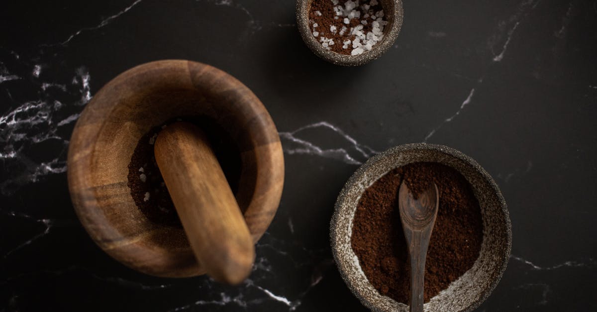 How to prevent salt from releasing from dry cured chicken? - High angle of wooden mortar and pestle placed near ceramic bowl with aromatic coffee on black marble table How to prevent salt from releasing from dry cured chicken? - High angle of wooden mortar and pestle placed near ceramic bowl with aromatic coffee on black marble table