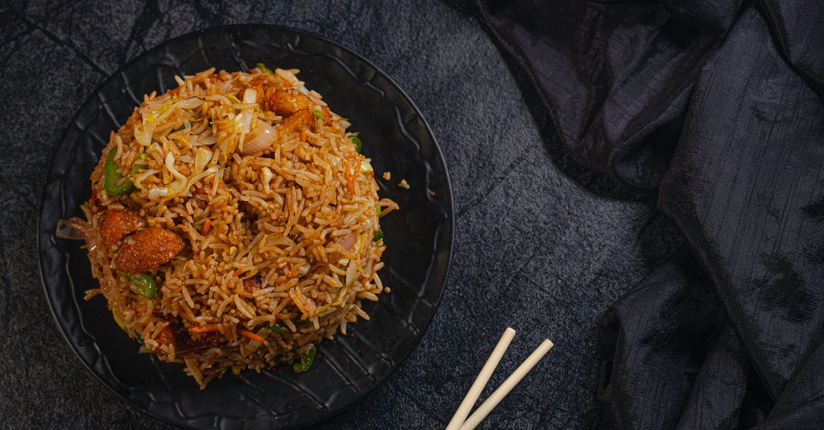 How to prevent the breading residue sticking in chicken fry? - Appetizing Asian dish with rice How to prevent the breading residue sticking in chicken fry? - Appetizing Asian dish with rice